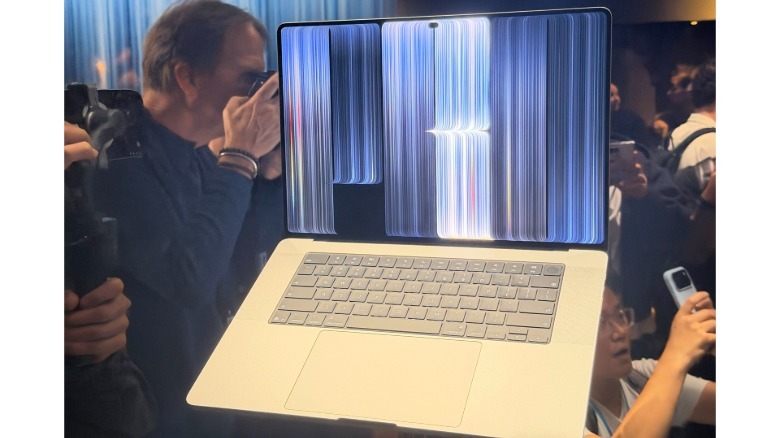 A MacBook Pro with OLED touchscreen.
