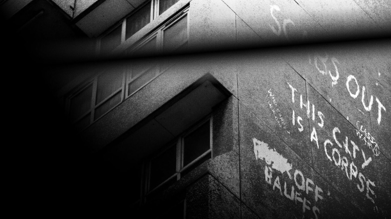 Graffiti on the side of a building reads