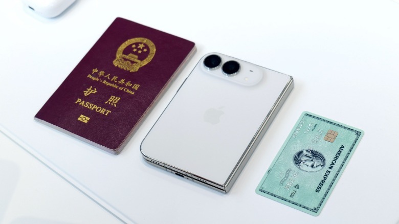 A size comparison between the iPhone Duo and a passport and credit card.