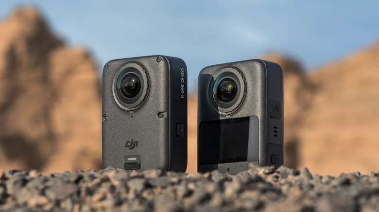 The front and back of the DJI Osmo 360 II are shown against mountains