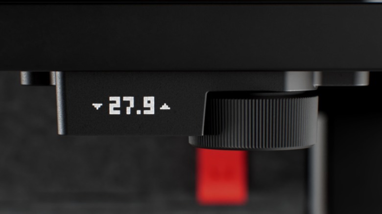 The notched adjustment know on the Herman Miller Coyl desk.