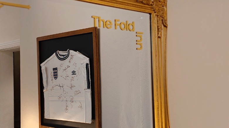 A framed and signed England football shirt